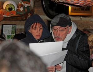 Alicia and Andrew Phillips review a winter star chart before leaving Red Fox Cabin for the trails.